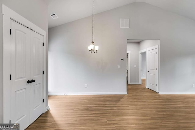 0 Grogan Rd, Buchanan, GA 30113 - unfurnished dining area featuring a chandelier, wood finished floors, baseboards, and vaulted ceiling