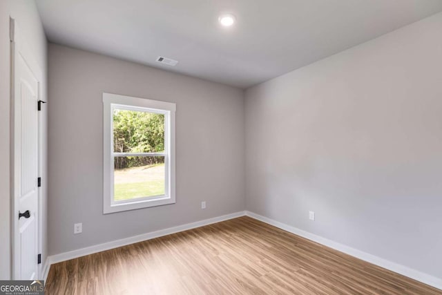 0 Grogan Rd, Buchanan, GA 30113 - unfurnished room featuring baseboards, wood finished floors, and recessed lighting