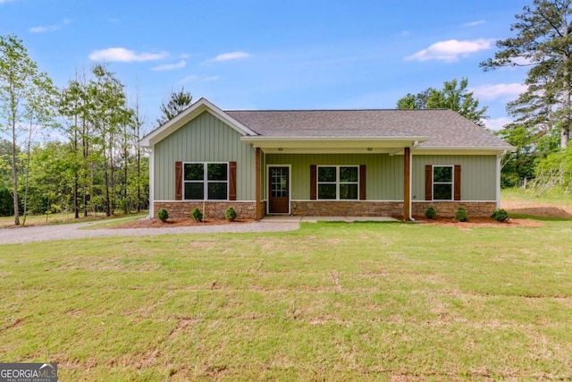 0 Grogan Rd, Buchanan, GA 30113 - view of front of house with a front lawn, roof with shingles, stone siding, and board and batten siding
