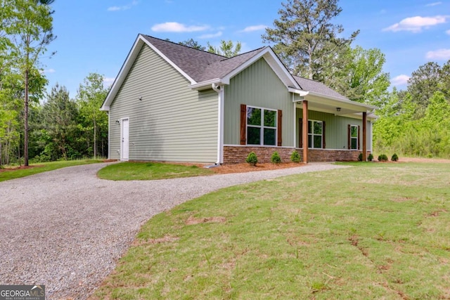 0 Grogan Rd, Buchanan, GA 30113 - view of home's exterior with gravel driveway, a yard, and a shingled roof