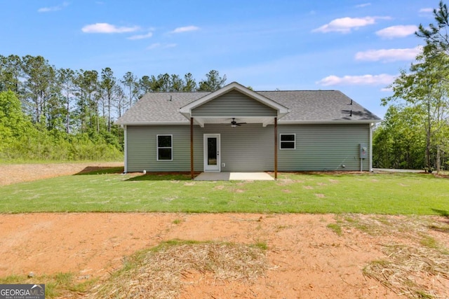 0 Grogan Rd, Buchanan, GA 30113 - rear view of house with a ceiling fan, a patio, a lawn, and roof with shingles