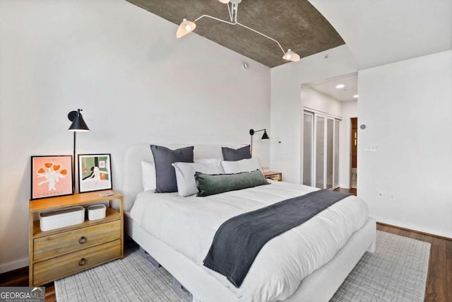 860 Peachtree St NE Unit 1513, Atlanta, GA 30308 - bedroom featuring wood finished floors, baseboards, recessed lighting, and a closet