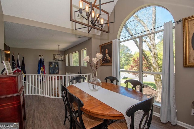 11 Line Creek Cir, Sharpsburg, GA 30277 - dining space with a chandelier, wood finished floors, and baseboards