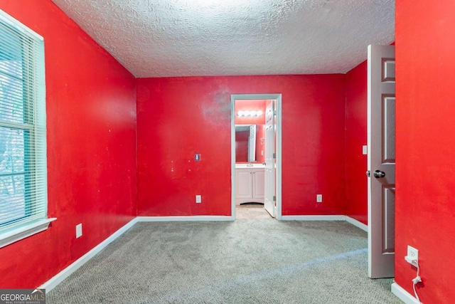 7074 Springgrove Ct, Austell, GA 30168 - unfurnished room with a textured ceiling, carpet flooring, and baseboards