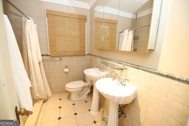 bathroom featuring ornamental molding, tile walls, toilet, tile patterned floors, and curtained shower