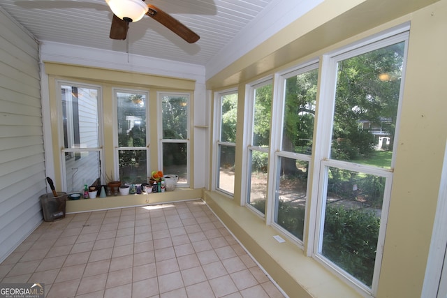 unfurnished sunroom with tile patterned floors and plenty of natural light