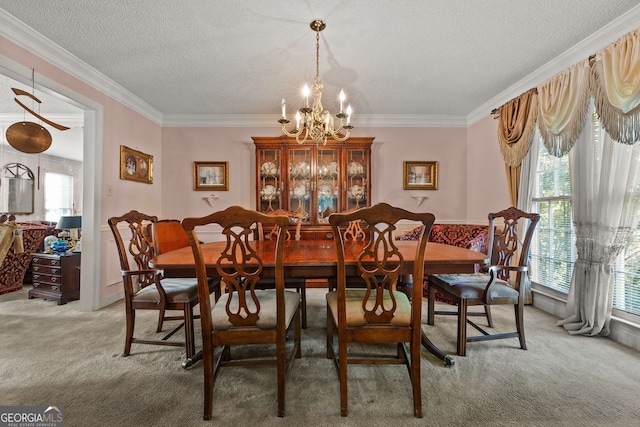 2810 Jodeco Ter, Jonesboro, GA 30236 - dining area featuring a chandelier, carpet, a textured ceiling, and ornamental molding