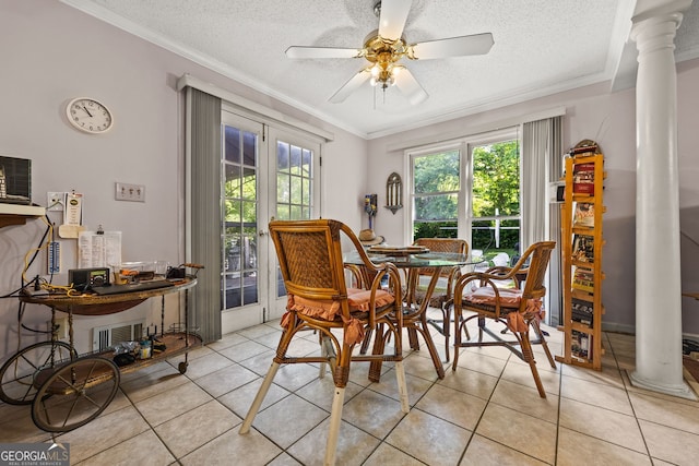 2810 Jodeco Ter, Jonesboro, GA 30236 - dining room with ornate columns, ornamental molding, light tile patterned floors, a textured ceiling, and a ceiling fan