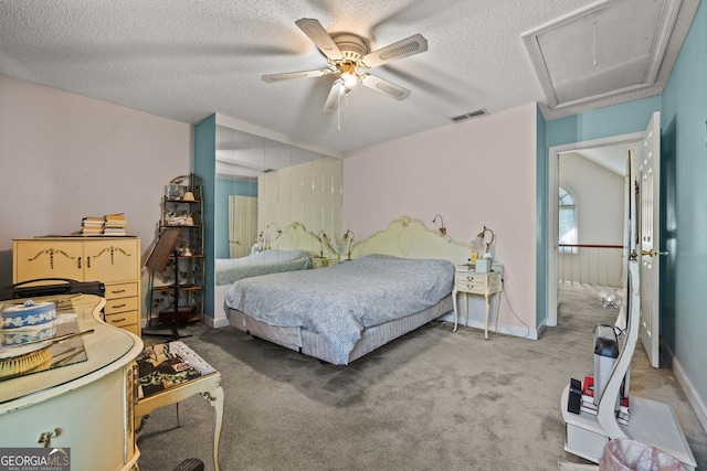 2810 Jodeco Ter, Jonesboro, GA 30236 - carpeted bedroom with attic access, a textured ceiling, a ceiling fan, and baseboards