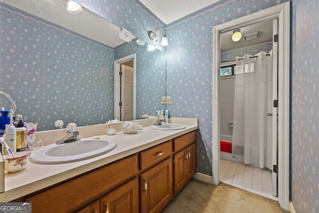 2810 Jodeco Ter, Jonesboro, GA 30236 - bathroom featuring wallpapered walls, tile patterned floors, double vanity, a textured ceiling, and shower / tub combo