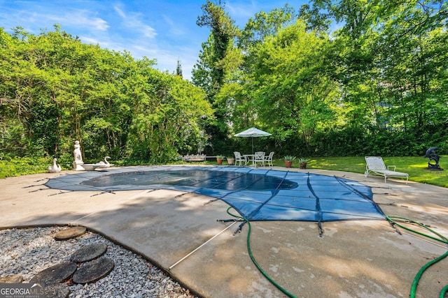 2810 Jodeco Ter, Jonesboro, GA 30236 - view of swimming pool featuring a patio area, a covered pool, and a diving board