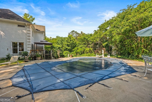 2810 Jodeco Ter, Jonesboro, GA 30236 - view of swimming pool featuring a diving board, a patio, a covered pool, and a deck