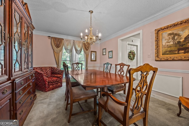 2810 Jodeco Ter, Jonesboro, GA 30236 - dining space featuring carpet floors, a chandelier, a textured ceiling, ornamental molding, and wainscoting
