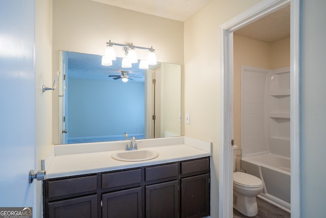 full bathroom featuring toilet, vanity, and shower / bathtub combination
