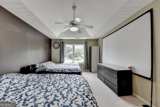 3668 Burel Mill Dr, Buford, GA 30519 - bedroom featuring a tray ceiling, light colored carpet, ceiling fan, and baseboards