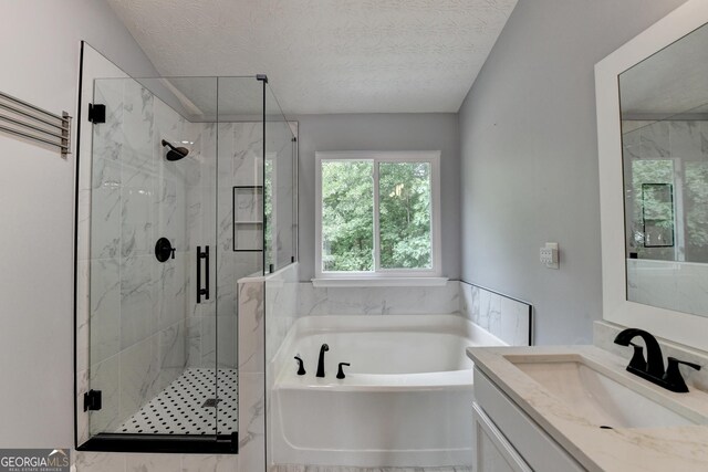 3668 Burel Mill Dr, Buford, GA 30519 - bathroom with a bath, a marble finish shower, vanity, and a textured ceiling