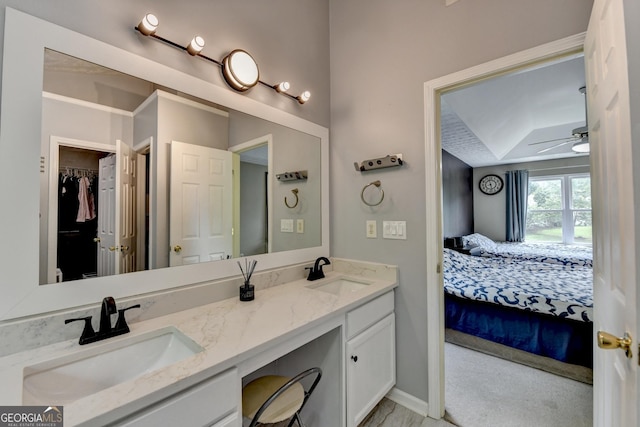 3668 Burel Mill Dr, Buford, GA 30519 - bathroom with double vanity, ensuite bathroom, a spacious closet, baseboards, and ceiling fan