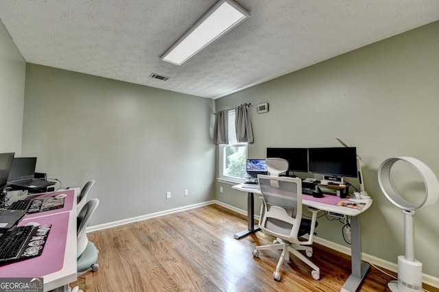 3668 Burel Mill Dr, Buford, GA 30519 - office featuring wood finished floors, baseboards, and a textured ceiling