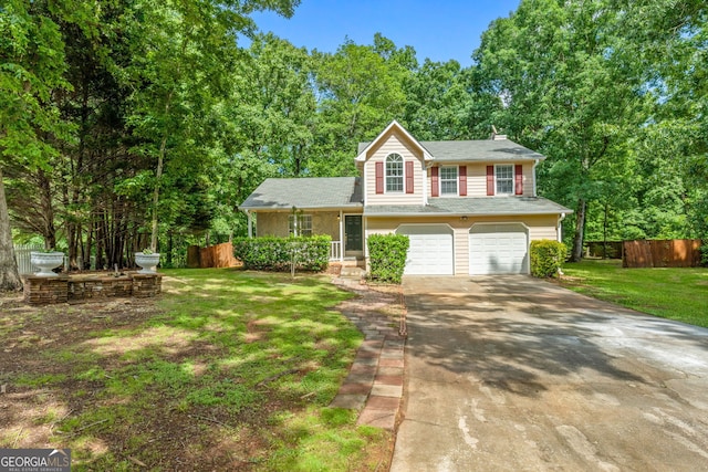 tri-level home featuring driveway, a garage, and a chimney