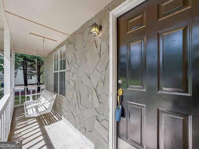 doorway to property with a porch