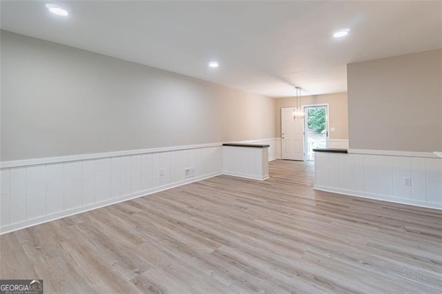 4171 Whispering Forest Ct SW, Lilburn, GA 30047 - empty room with light wood-style flooring, wainscoting, and recessed lighting