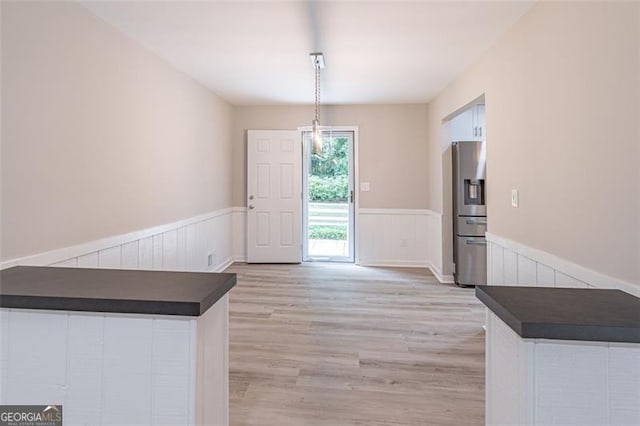 4171 Whispering Forest Ct SW, Lilburn, GA 30047 - entryway featuring wainscoting and light wood-style flooring