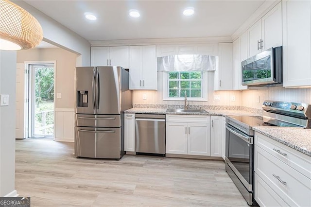 4171 Whispering Forest Ct SW, Lilburn, GA 30047 - kitchen featuring stainless steel appliances, a sink, white cabinetry, and recessed lighting