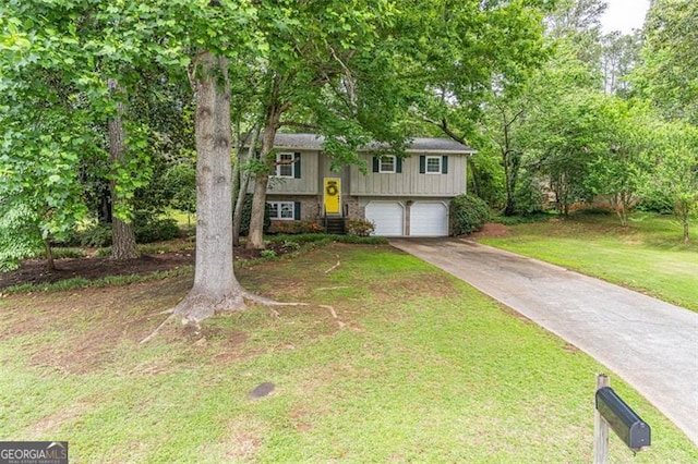 4171 Whispering Forest Ct SW, Lilburn, GA 30047 - split foyer home with concrete driveway, an attached garage, and a front lawn