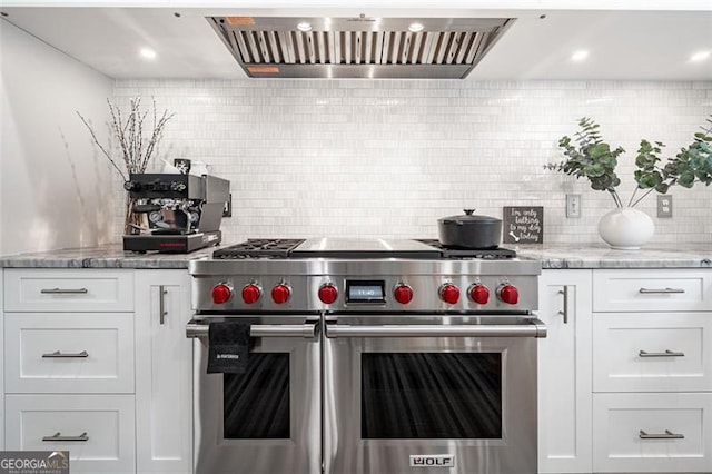 5370 Newport Bay, Alpharetta, GA 30005 - kitchen featuring range with two ovens, tasteful backsplash, white cabinets, light stone counters, and custom range hood