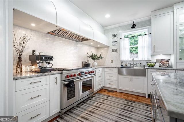 5370 Newport Bay, Alpharetta, GA 30005 - kitchen featuring range with two ovens, a sink, decorative backsplash, and white cabinetry