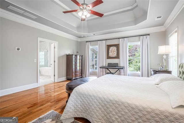 5370 Newport Bay, Alpharetta, GA 30005 - bedroom with a raised ceiling, wood finished floors, baseboards, ornamental molding, and connected bathroom