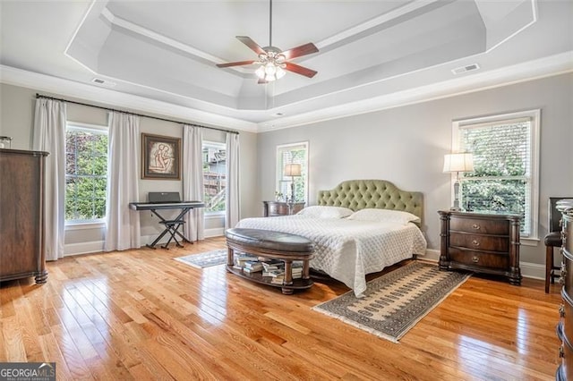 5370 Newport Bay, Alpharetta, GA 30005 - bedroom with a raised ceiling, multiple windows, crown molding, and hardwood / wood-style flooring