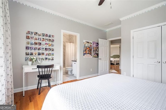 5370 Newport Bay, Alpharetta, GA 30005 - bedroom with light wood-style flooring, a closet, crown molding, baseboards, and ensuite bath