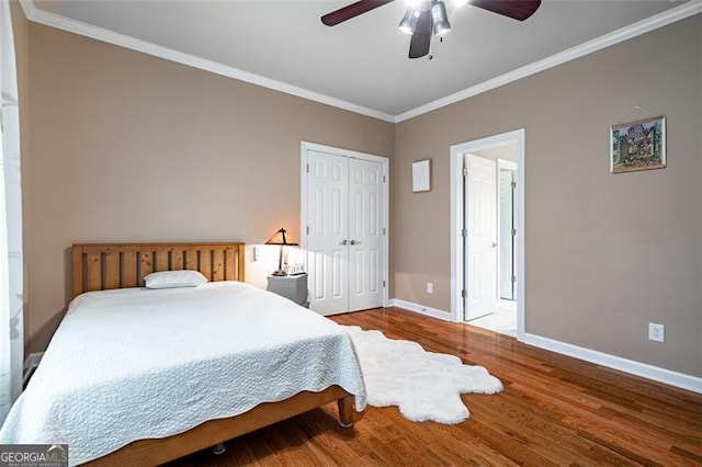 5370 Newport Bay, Alpharetta, GA 30005 - bedroom featuring baseboards, crown molding, wood finished floors, a closet, and ceiling fan