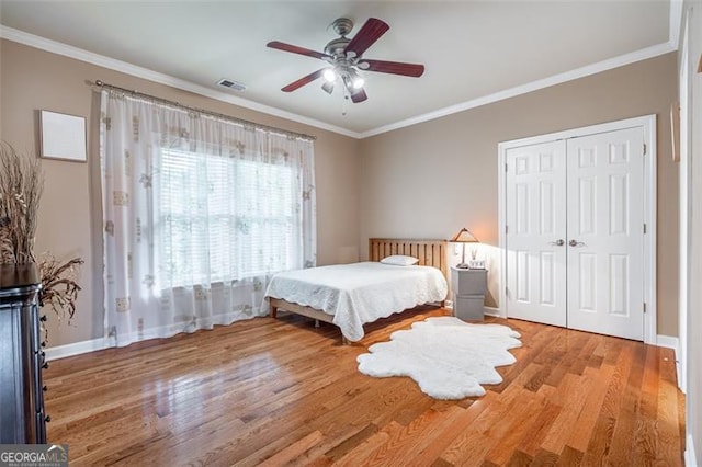 5370 Newport Bay, Alpharetta, GA 30005 - bedroom featuring wood finished floors, baseboards, ornamental molding, a closet, and ceiling fan