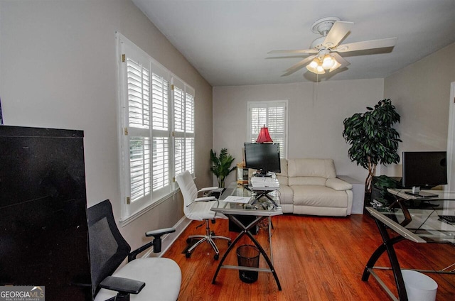 office featuring wood finished floors and a ceiling fan