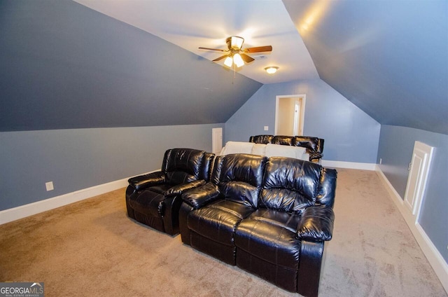 carpeted home theater featuring a ceiling fan, lofted ceiling, and baseboards