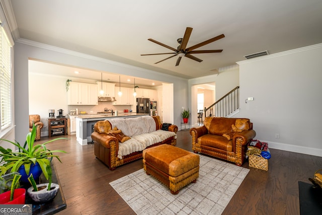 4832 Stone Way Path, Buford, GA 30519 - living room featuring a ceiling fan, crown molding, dark wood-style flooring, stairs, and baseboards