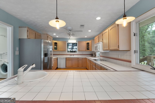 312 Flat Shoals Church Rd, Stockbridge, GA 30281 - kitchen with white appliances, washer / clothes dryer, a ceiling fan, glass insert cabinets, and plenty of natural light
