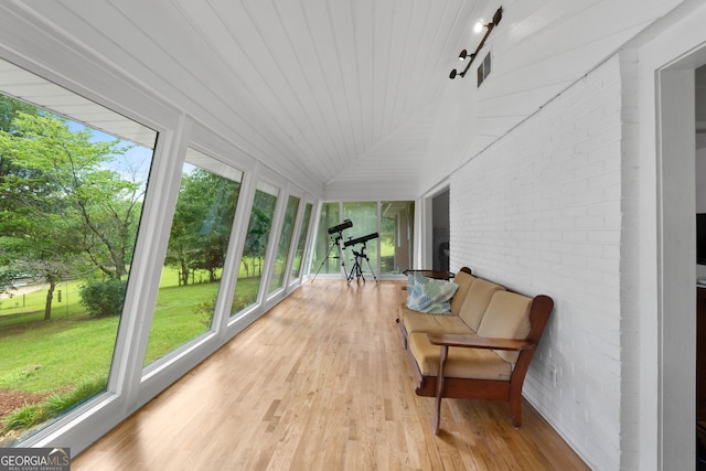 312 Flat Shoals Church Rd, Stockbridge, GA 30281 - sunroom with brick wall and wood finished floors