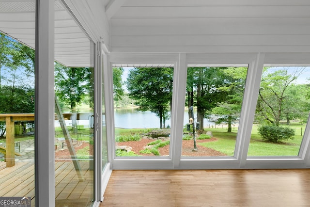 312 Flat Shoals Church Rd, Stockbridge, GA 30281 - unfurnished sunroom featuring wood finished floors and a deck with water view