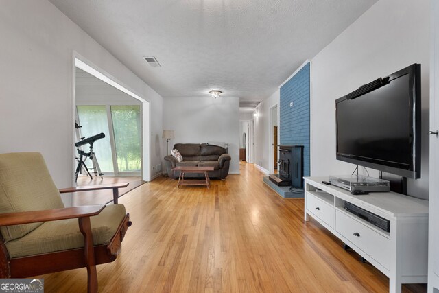 312 Flat Shoals Church Rd, Stockbridge, GA 30281 - living area with light wood-type flooring and a textured ceiling