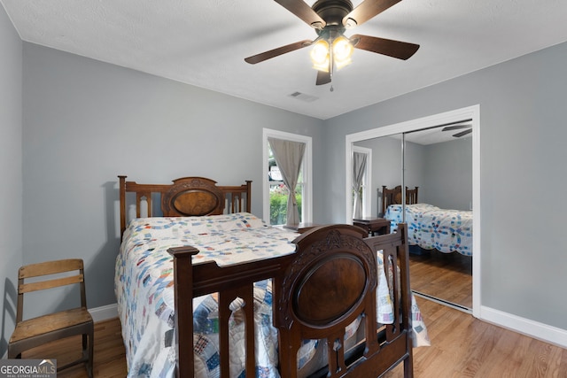 312 Flat Shoals Church Rd, Stockbridge, GA 30281 - bedroom featuring baseboards, light wood-style floors, a closet, and ceiling fan