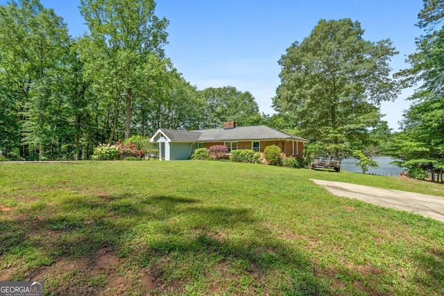 312 Flat Shoals Church Rd, Stockbridge, GA 30281 - ranch-style house with a chimney and a front yard