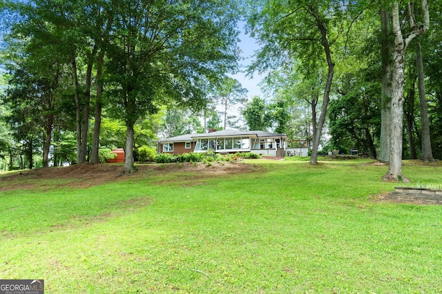 312 Flat Shoals Church Rd, Stockbridge, GA 30281 - view of grassy yard featuring covered porch