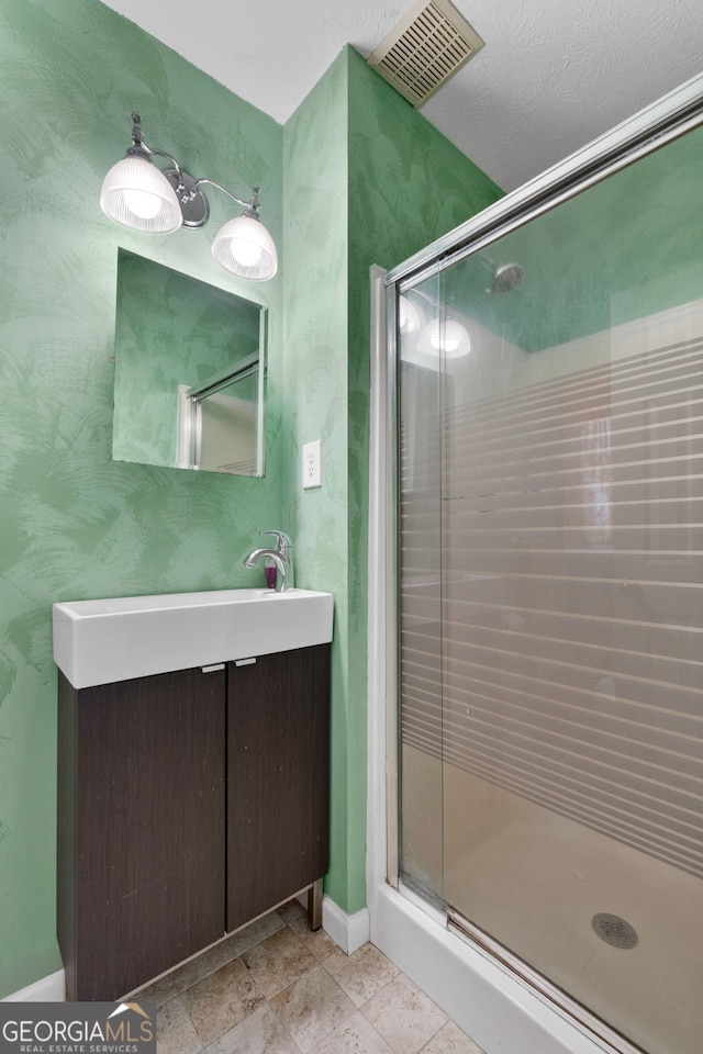 312 Flat Shoals Church Rd, Stockbridge, GA 30281 - bathroom with a shower stall, baseboards, and vanity