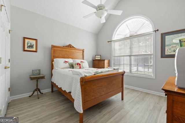 1152 Strath Clyde Way, Mcdonough, GA 30253 - bedroom featuring light wood-style flooring, baseboards, ceiling fan, and high vaulted ceiling