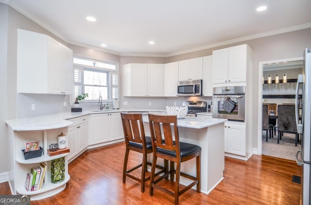 6450 Oak Valley Dr, Cumming, GA 30040 - kitchen with stainless steel appliances, a breakfast bar, open shelves, white cabinets, and crown molding