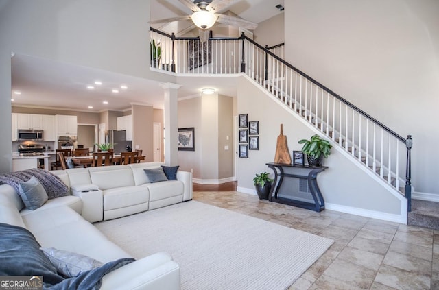 6450 Oak Valley Dr, Cumming, GA 30040 - living room featuring a high ceiling, a ceiling fan, stairs, and recessed lighting