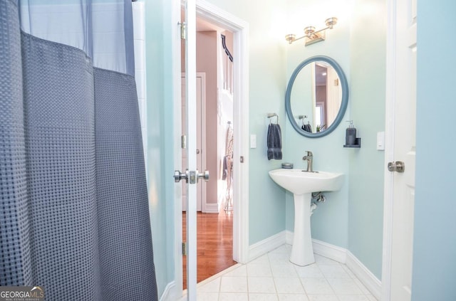 6450 Oak Valley Dr, Cumming, GA 30040 - bathroom with curtained shower and tile patterned flooring